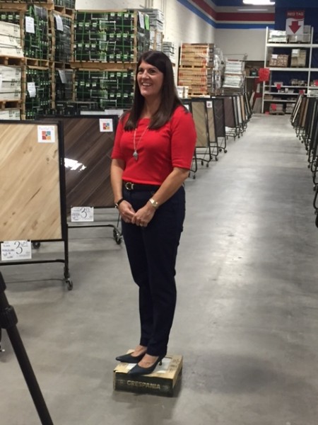 Kate getting ready to explain what you can expect when you shop Tile Outlets