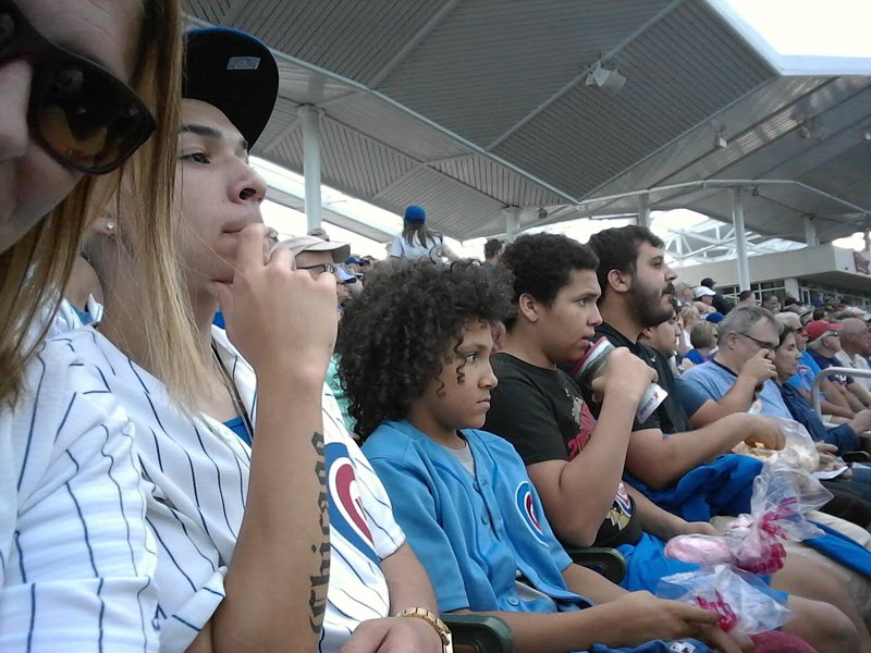 Anna Robinson and her family watching a Chicago Cubs Game