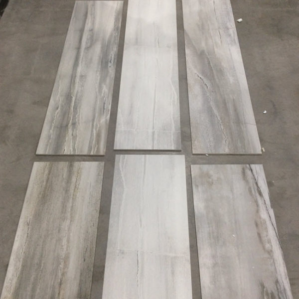 The entire floor was done using Waterfalls Whitewater 12x48 porcelain plank