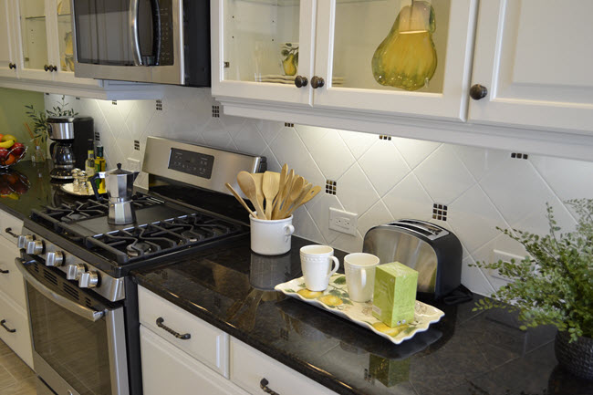 White Ice Bright 6x6 backsplash looks installed on the diagonal with the addition of colored glass mosaics.