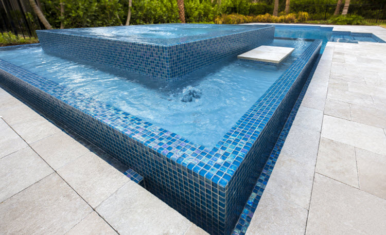 Glass mosaics can be used for spillover water features.