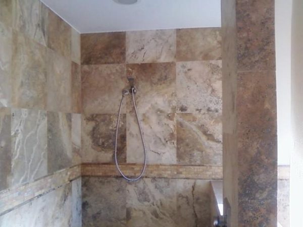 Planning for shade variation. Notice the checkerboard pattern used in the top portion of the shower wall, in contrast to the more uniform bottom shower wall.