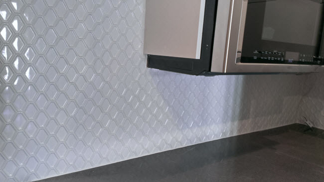 This image features White Porcelain Diamond Mosaic in a kitchen backsplash.